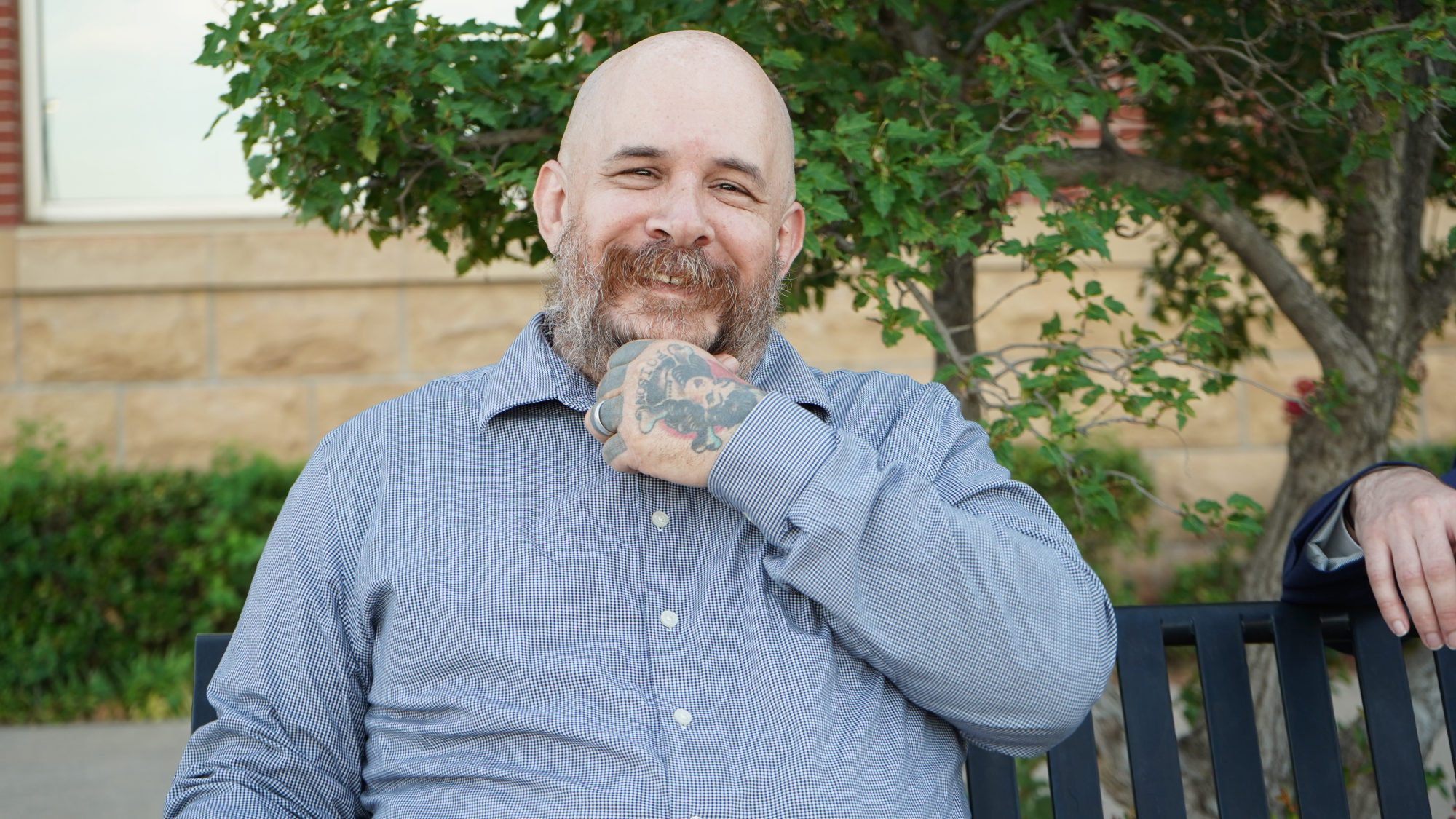 Matt Daniel, founder of Stonewall Security, seated outdoors.